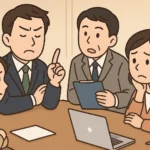 会議で自分が正しいと主張する男性社員と、困惑しつつも冷静に対応しようとする同僚の日本人会社員を描いたイラスト